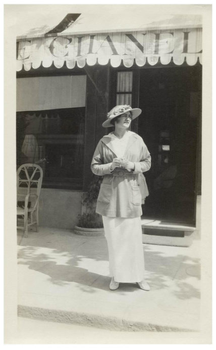 Chanel in front of her boutique in Deauville, 1913